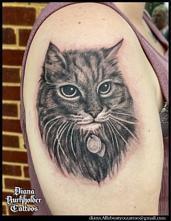 Black and grey cat tattoo