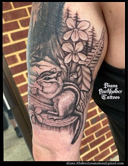 Black and grey chipmunk tattoo