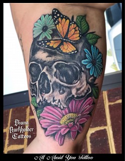 Skull with flowers tattoo